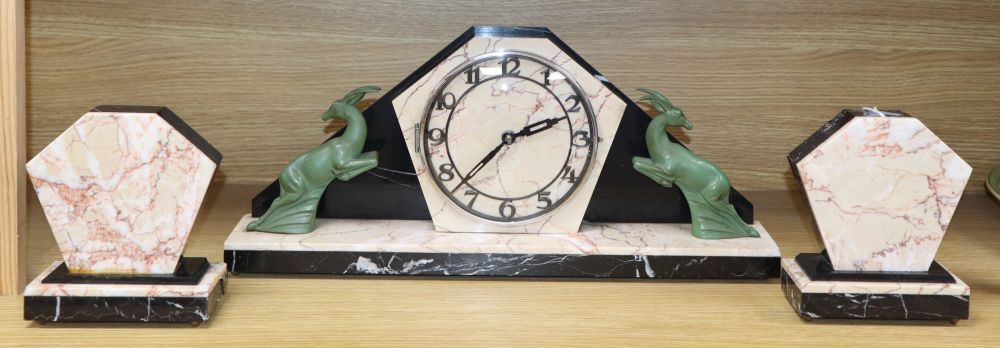An Art Deco spelter and marble clock garniture, W.45cm, H.29cm